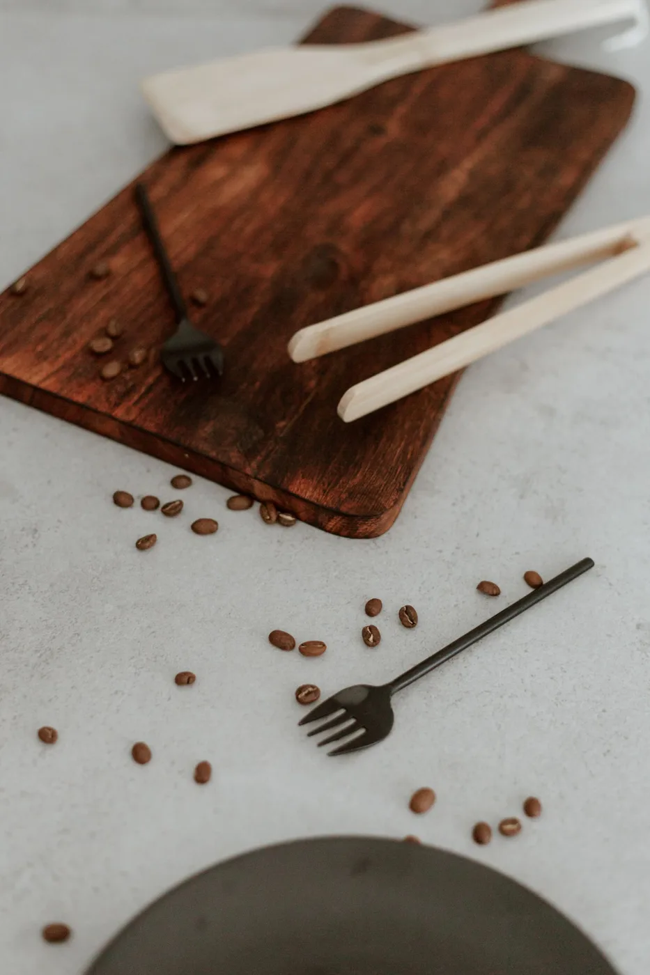 Cutting Board, Forks, Tongs and Coffee Beans on Kitchen Counter