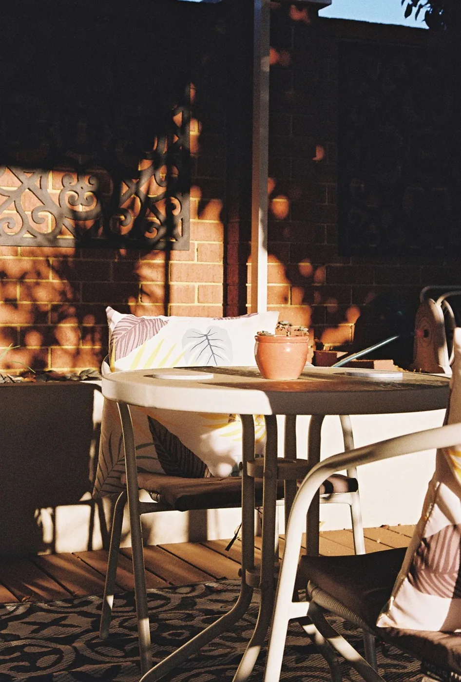 Cozy Outdoor Patio with Sunlit Table Setting