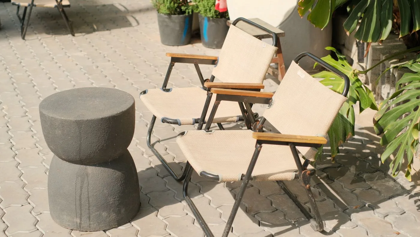 Outdoor Patio Scene with Sunlit Chairs